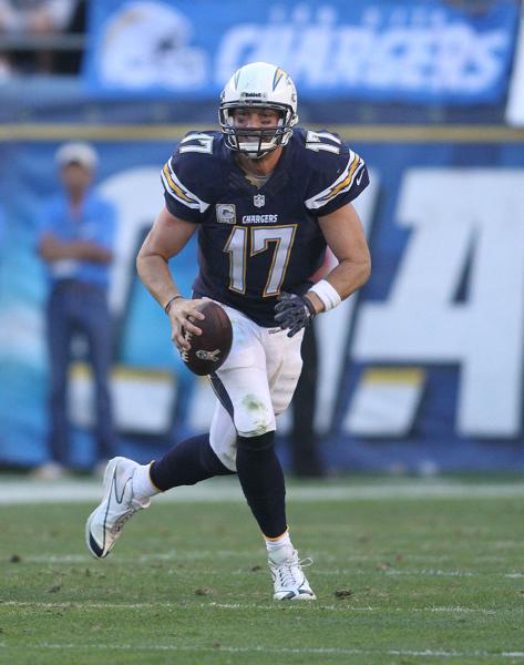 Philip Rivers, on the move  here against the Denver Broncos, is hoping to lead the Chargers into the playoffs. Photo Credit: Kevin Reece/News4usonline.com 