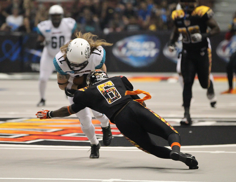 Romeo Pellum Kiss Defensive back coming up to stop Rattlers Tysson Poots. Photo Credit: Jordon Kelly / News4usonline.com