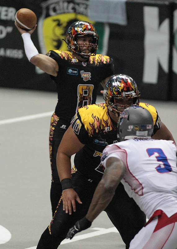Aaron Garcia Standing Tall in the Pocket to Deliver a Dart. Photo Credit : Jevone Moore /News4usonline.com