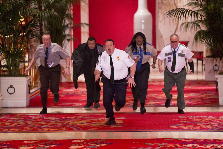 Paul Blart (Kevin James) with Gino Chizetti (Vic DiBitetto) , Khan Mubi (Shelly Desai), Donna Ericone (Loni Love) and Saul Gundermutt (Gary Valentine) take on the art thieves in the grand hallway in Columbia Pictures' PAUL BLART: MALL COP 2.