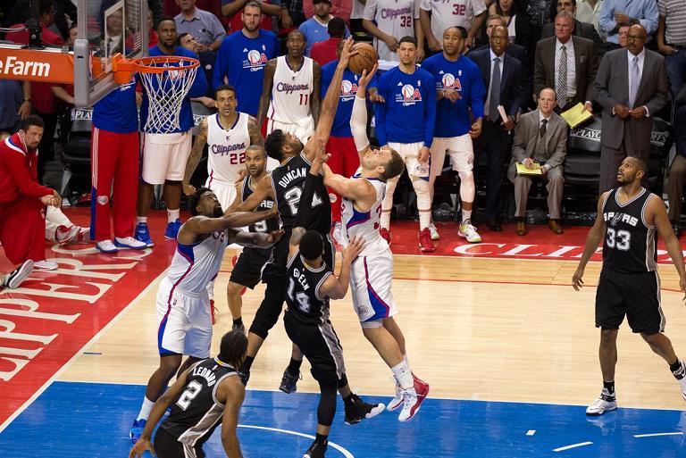 Blake Griffin has his shot blocked by the spurs' Tim Duncan as time winds down in the fourth quarter in Game 5 at Staples Center. Photo Credit: Tiffany Zablosky/News4usonline.com