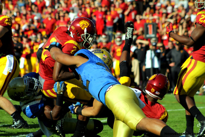 Adoree' Jackson (2) is wrapped up by several UCLA defenders. Photo by Dennis J. Freeman/News4usonline.com