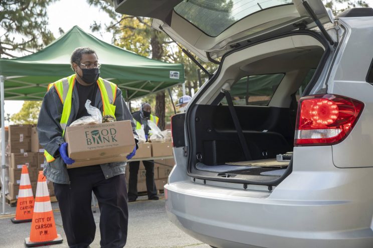 Los Angeles Regional Food Bank passes out food to residents in South Los Angeles 