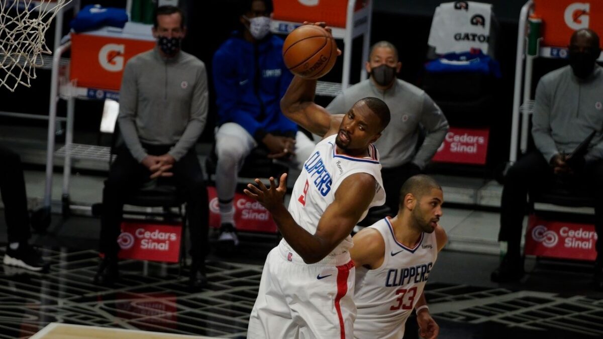 Center Serge Ibaka has been a welcming presence for the Los Angeles Clippers thus far this season. Ibaka grabs a rebound during the Clippers' 124-101 win against the Minnesota Timberwolves on Wednesday, Dec. 29, 2020. Photo by Melinda Meijer for News4usonline