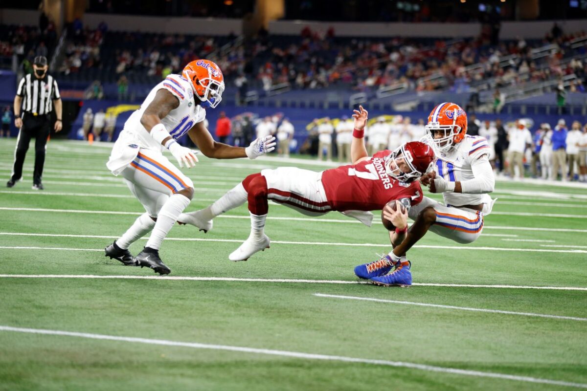 Florida defenders yank down Oklahoma quarterback Spencer Rattler (7) for a big play during the 2020 Goodyear Cotton Bowl Classic. Rattler and the Sooners prevailed with a 55-20 win against the Gators. Courtesy photo