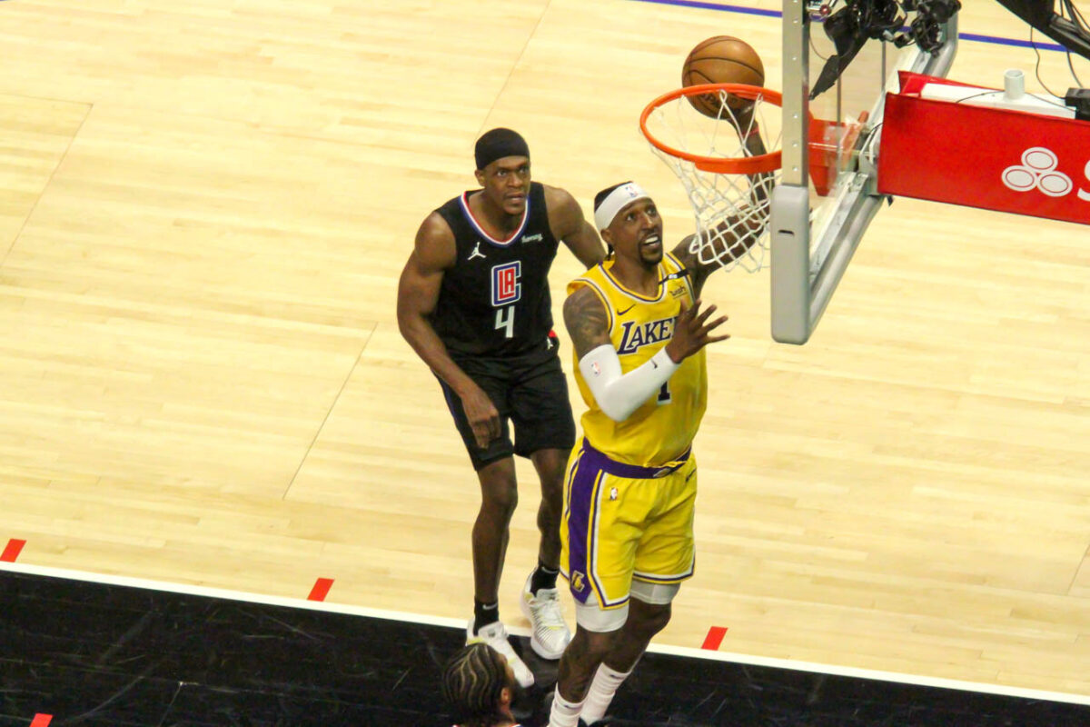 Los Angeles Clippers guard Rajon Rondo (4) watches Kentavious Caldwell-Pope score a layup during a May 6, 2021 matchup between the two teams. The Clippers defeated the Lakers, 118-94. Photo by Dennis J. Freeman/News4usonline