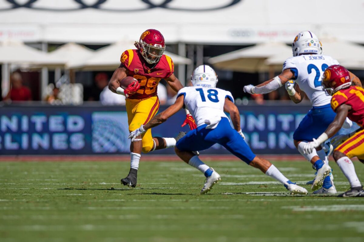 Sept. 4, 2021. USC running back Keaontay Ingram (28) runs by a San Jose State defender during the Trojans' 30-7 win at the Los Angeles Memorial Coliseum. Photo credit: Sammy Saludo/News4usonline