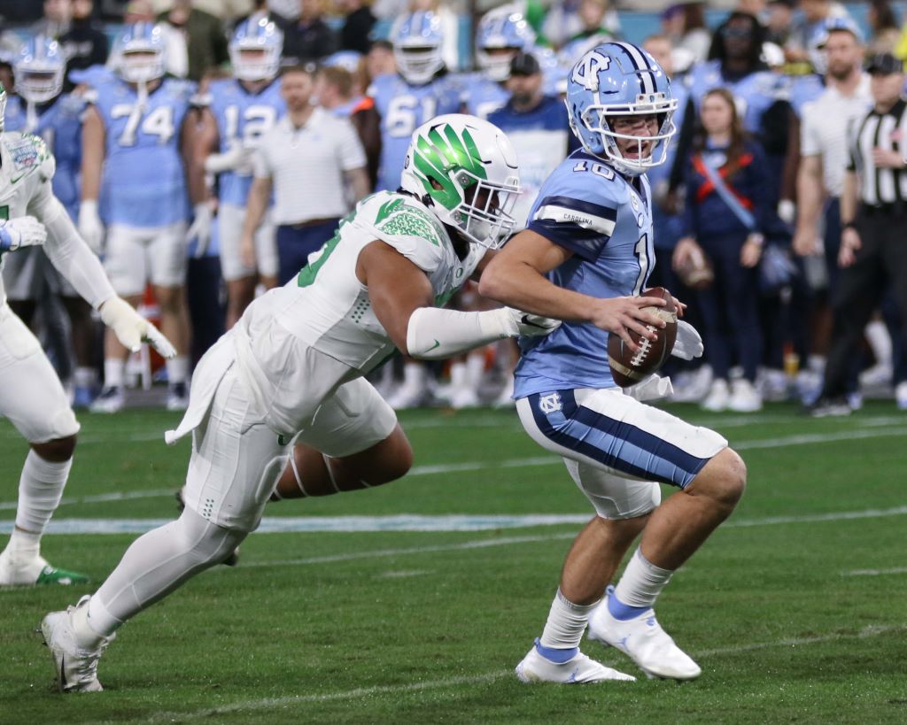 North Carolina quarterback Drake Maye trying to make a play against Oregon in the 2022 San Diego County Credit Union Holiday Bowl on Dec. 28, 2022. 