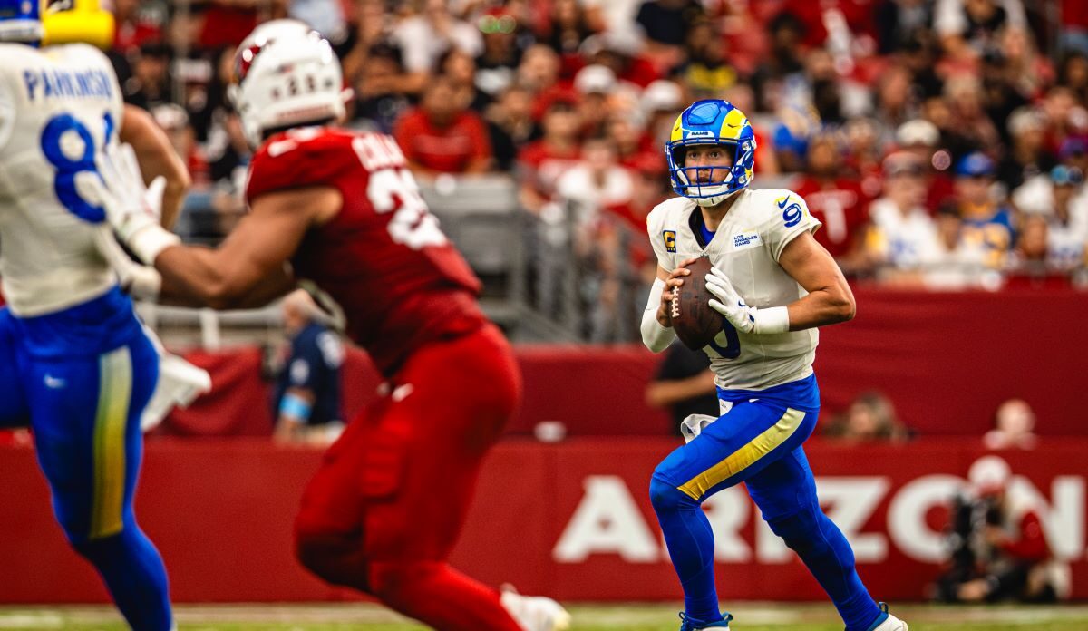 Los Angeles Rams quarterback Matthew Stafford looks downfield to throw the football against the Arizona Cardinals in an NFL game played at State Farm Stadium in Glendale, Arizona